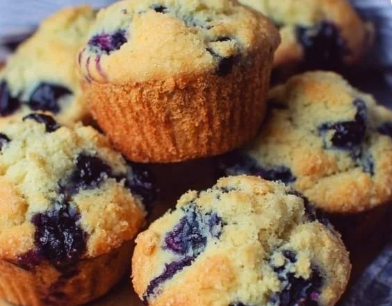 Freshly baked Bisquick blueberry muffins on a cooling rack