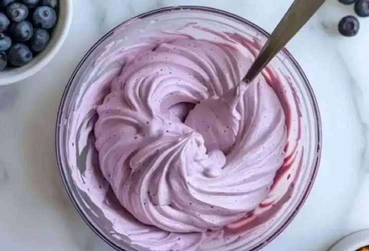 Delicious Blueberry Cream Cheese Frosting on a cupcake
