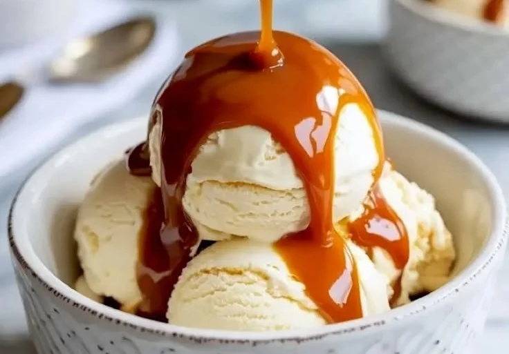 Homemade caramel sauce made from condensed milk in a glass jar