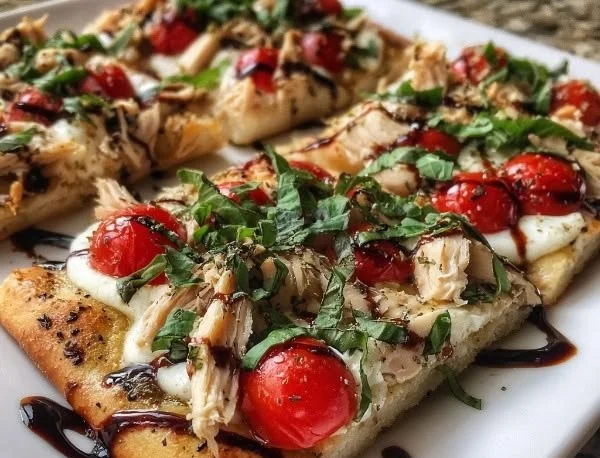 Delicious Chicken Caprese Flatbread topped with mozzarella, tomatoes, and basil.