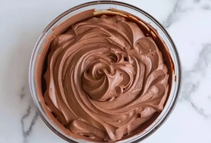 Decadent Chocolate Mousse Cake with rich filling and chocolate garnishes