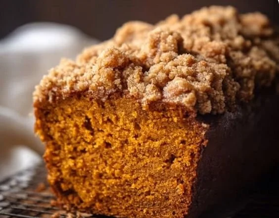 Deliciously baked Cinnamon Crumb Pumpkin Bread with a crumb topping