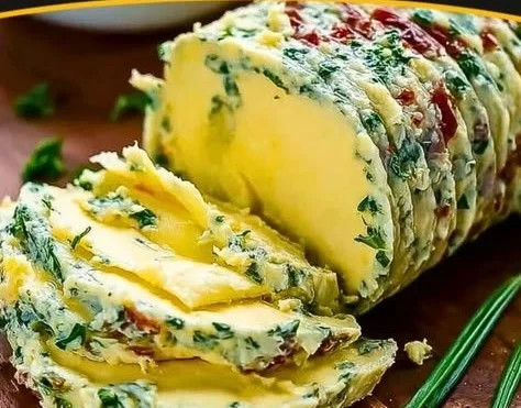 Delicious Cowboy Butter Steak served on a grill plate with herbs