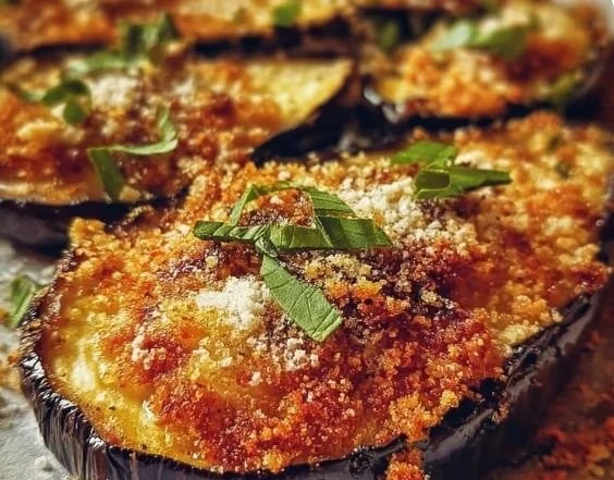 Crispy baked eggplant slices prepared with herbs and spices.
