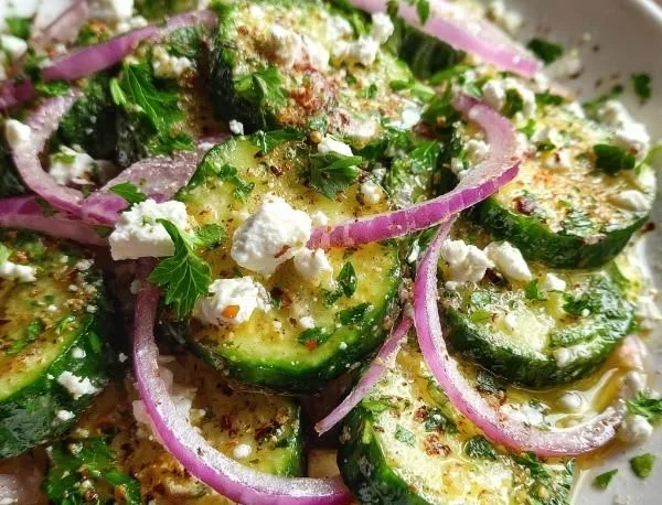 Cucumber Feta Salad drizzled with Lemon Greek Vinaigrette served in a bowl