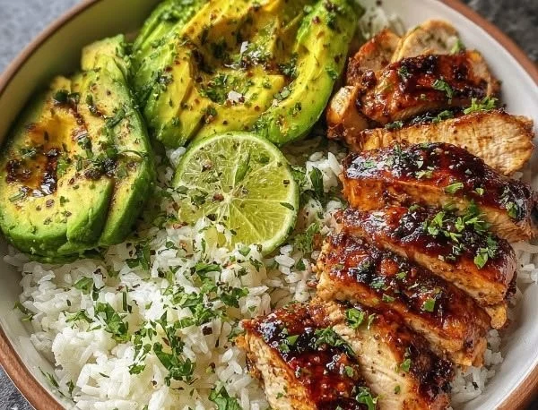 Delicious honey lime chicken served in a fresh avocado rice bowl