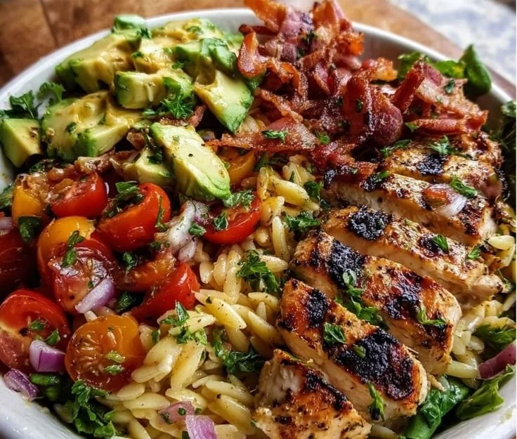Lemon-Herb Grilled Chicken served with Avocado Orzo Salad