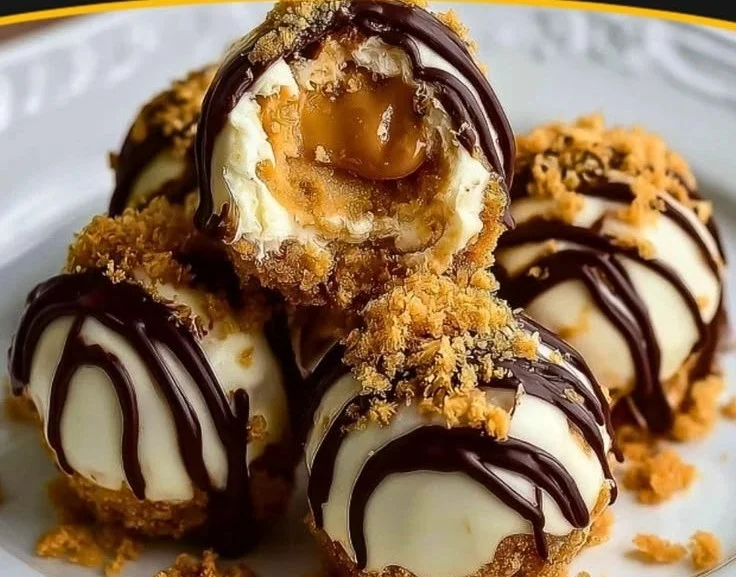 No-bake peanut butter cheesecake balls topped with chocolate drizzle