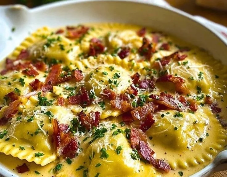 Delicious Olive Garden-inspired ravioli carbonara served with crispy bacon and parmesan.