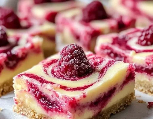 Delicious lemon raspberry swirl bars on a plate