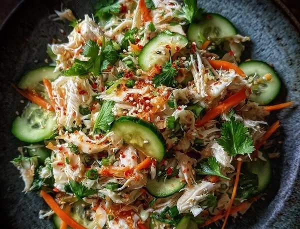 Zesty chilled Asian crab salad served in a bowl with fresh vegetables