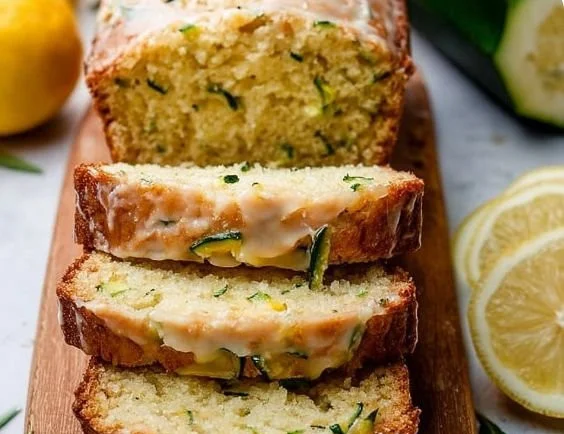 Loaf of award-winning lemon zucchini bread with lemon zest and fresh zucchini