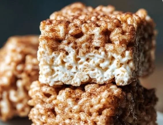 Churro Rice Krispie Treats drizzled with caramel and sprinkled with cinnamon sugar