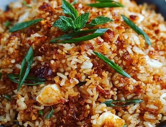 Bobby Flay's crispy rice recipe served in a bowl with garnish
