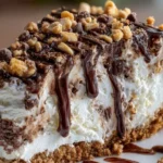 Delicious Drumstick Ice Cream Cake topped with crunchy chocolate and nuts