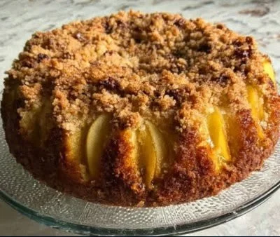 Easy homemade maple pear cake with slices of pear and maple syrup glaze.