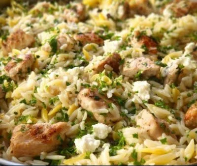 Lemon Feta Chicken served over orzo with fresh herbs