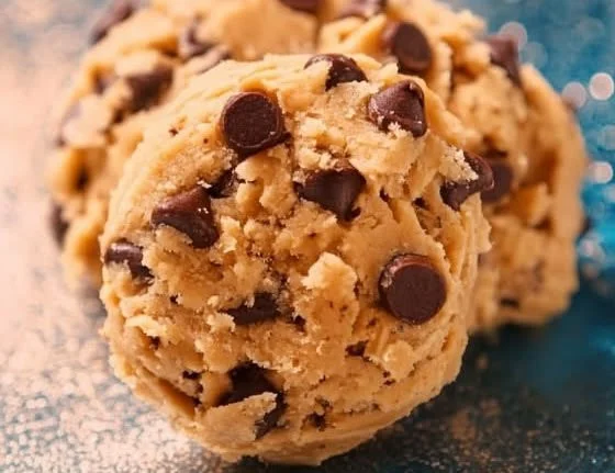 Protein-packed edible cookie dough in a bowl with a spoon