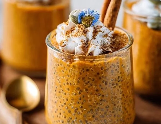 Delicious pumpkin chia pudding served in a bowl topped with spices and seeds