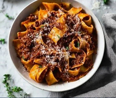 A rich and hearty bowl of short rib bolognese served over pasta