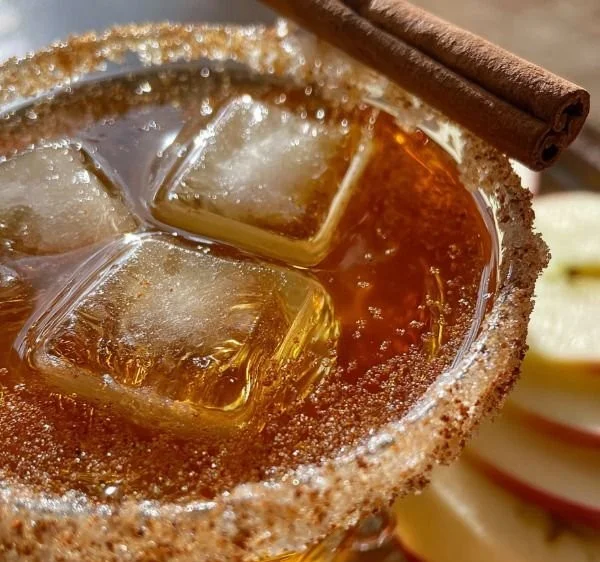 Freshly made Apple Cider Martini garnished with apple slices
