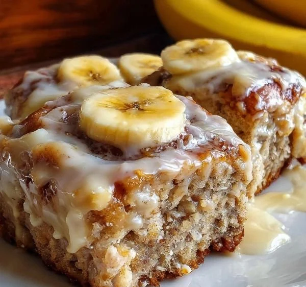 Delicious banana bread cinnamon rolls topped with cinnamon glaze.