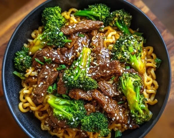 Beef and broccoli stir-fry served in a vibrant bowl with vegetables and rice.
