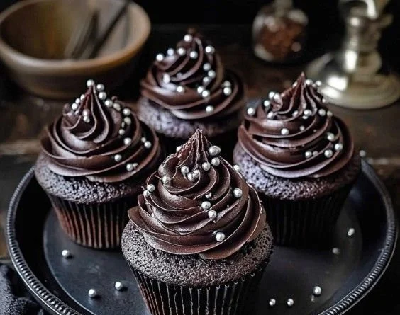 Delicious black velvet cupcakes topped with cream cheese frosting