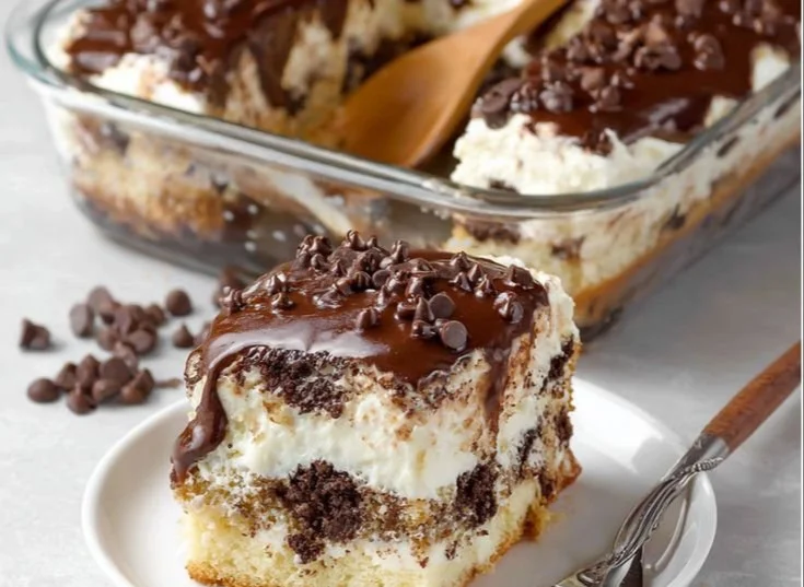 Delicious cannoli cake topped with cream and chocolate chips