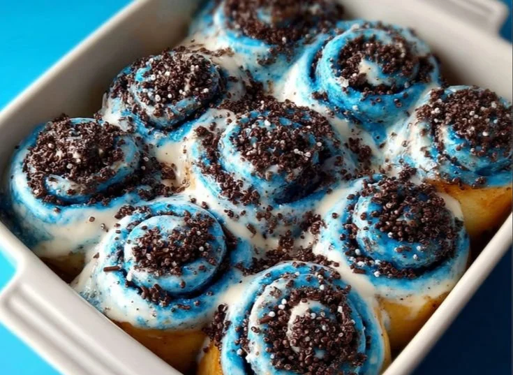 Creamy Oreo cinnamon roll topped with icing and crushed Oreos.